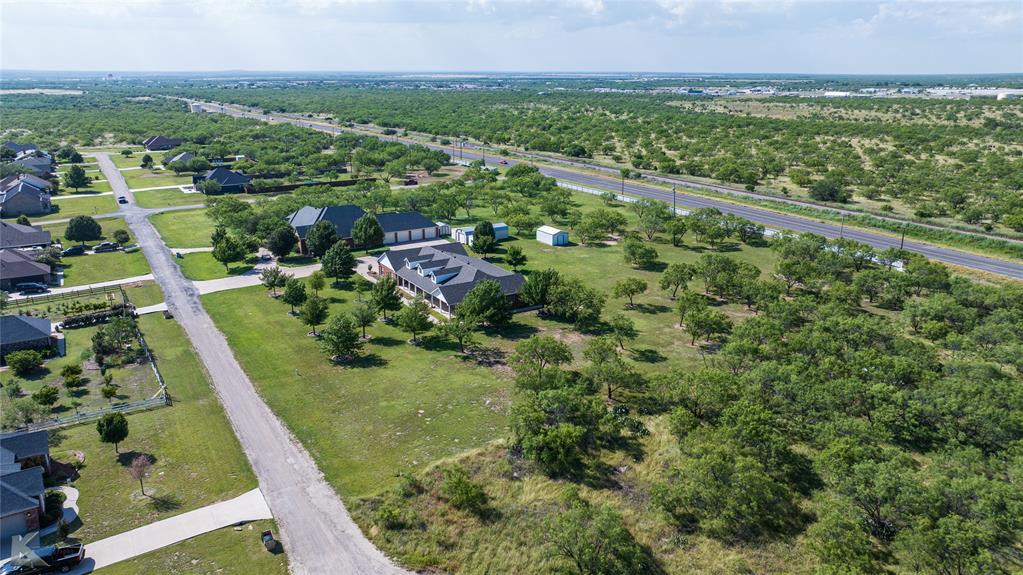 13063 Rainey Ridge Lane Abilene, TX 79602 - Photo 33 of 40 a view of a city with lush green forest
