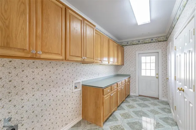 a kitchen with a sink and cabinets