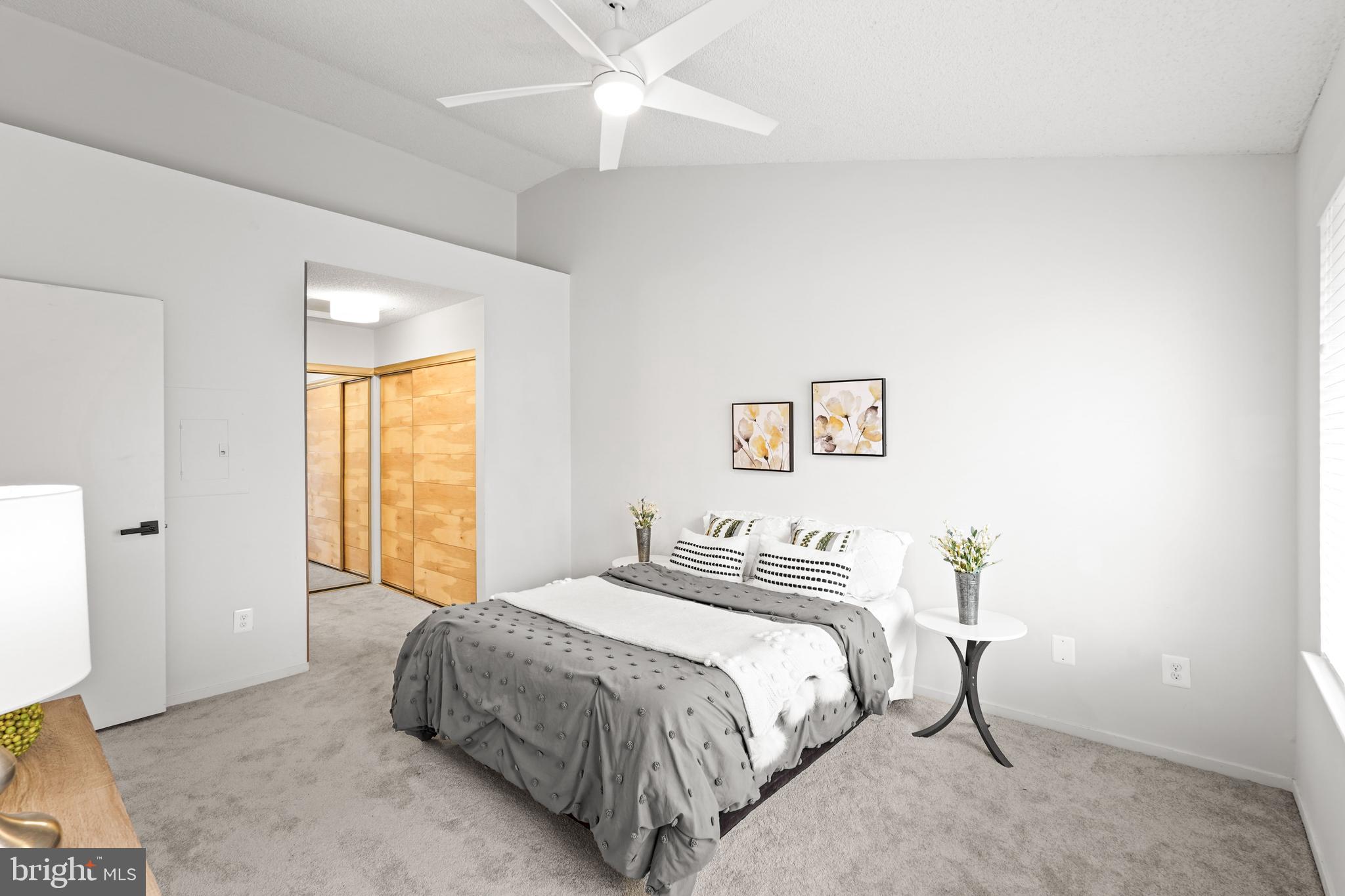 11731 Summerchase Circle, Unit 1731E Reston, VA 20194 - Photo 10 of 30 a spacious bedroom with a bed and a window