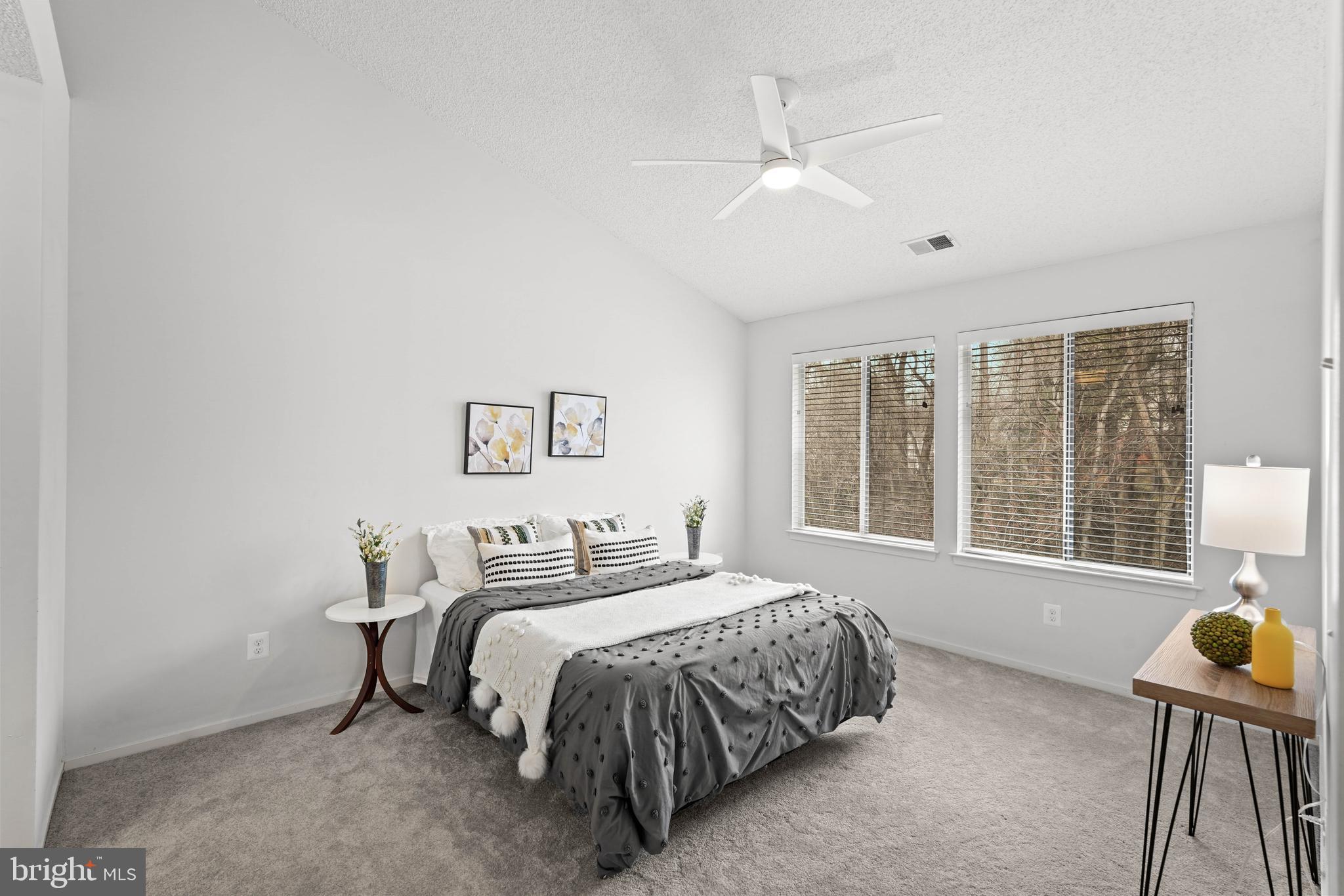 11731 Summerchase Circle, Unit 1731E Reston, VA 20194 - Photo 11 of 30 a bedroom with a bed and a window