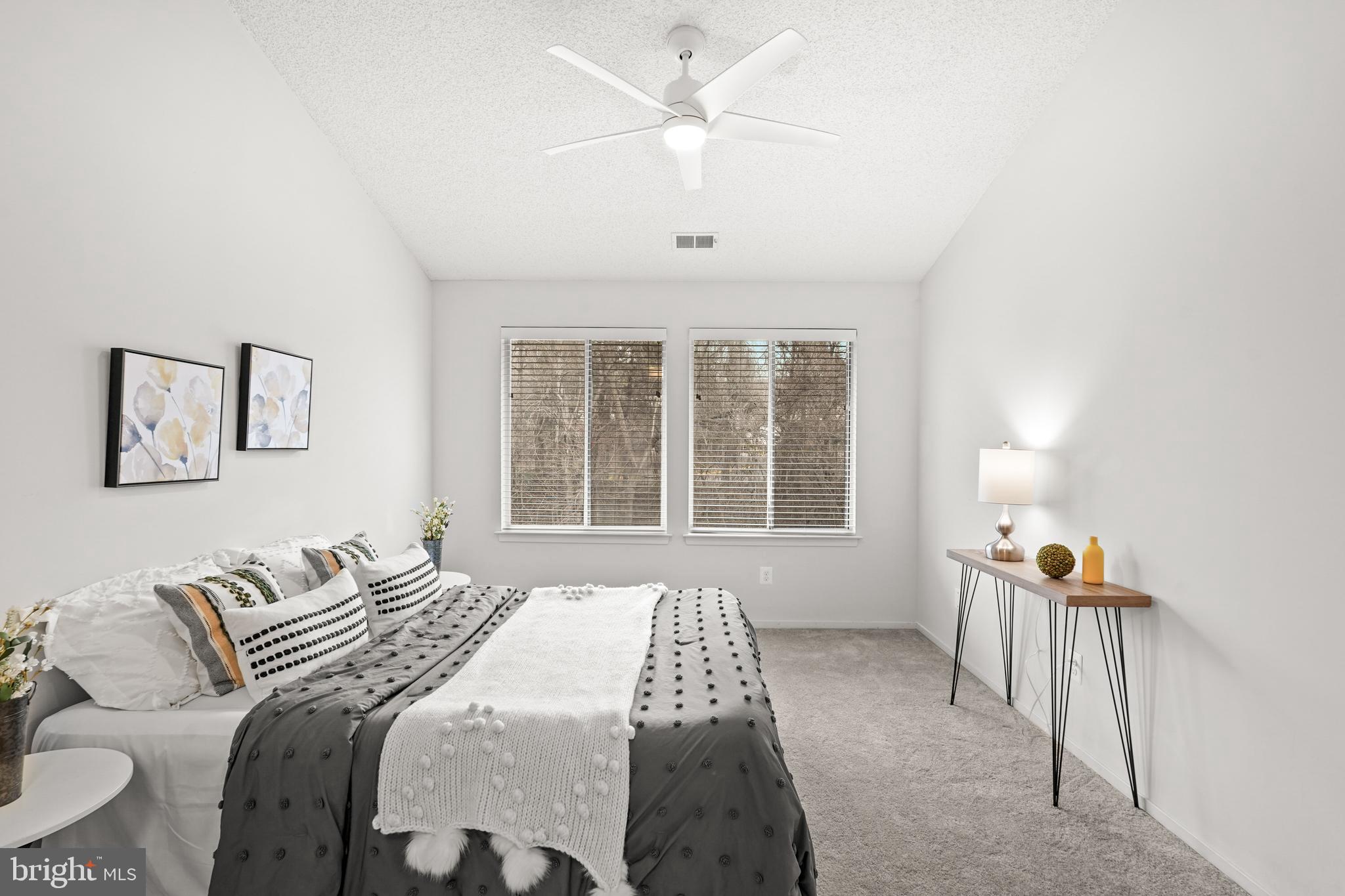 11731 Summerchase Circle, Unit 1731E Reston, VA 20194 - Photo 14 of 30 a bedroom with a bed furniture and a window