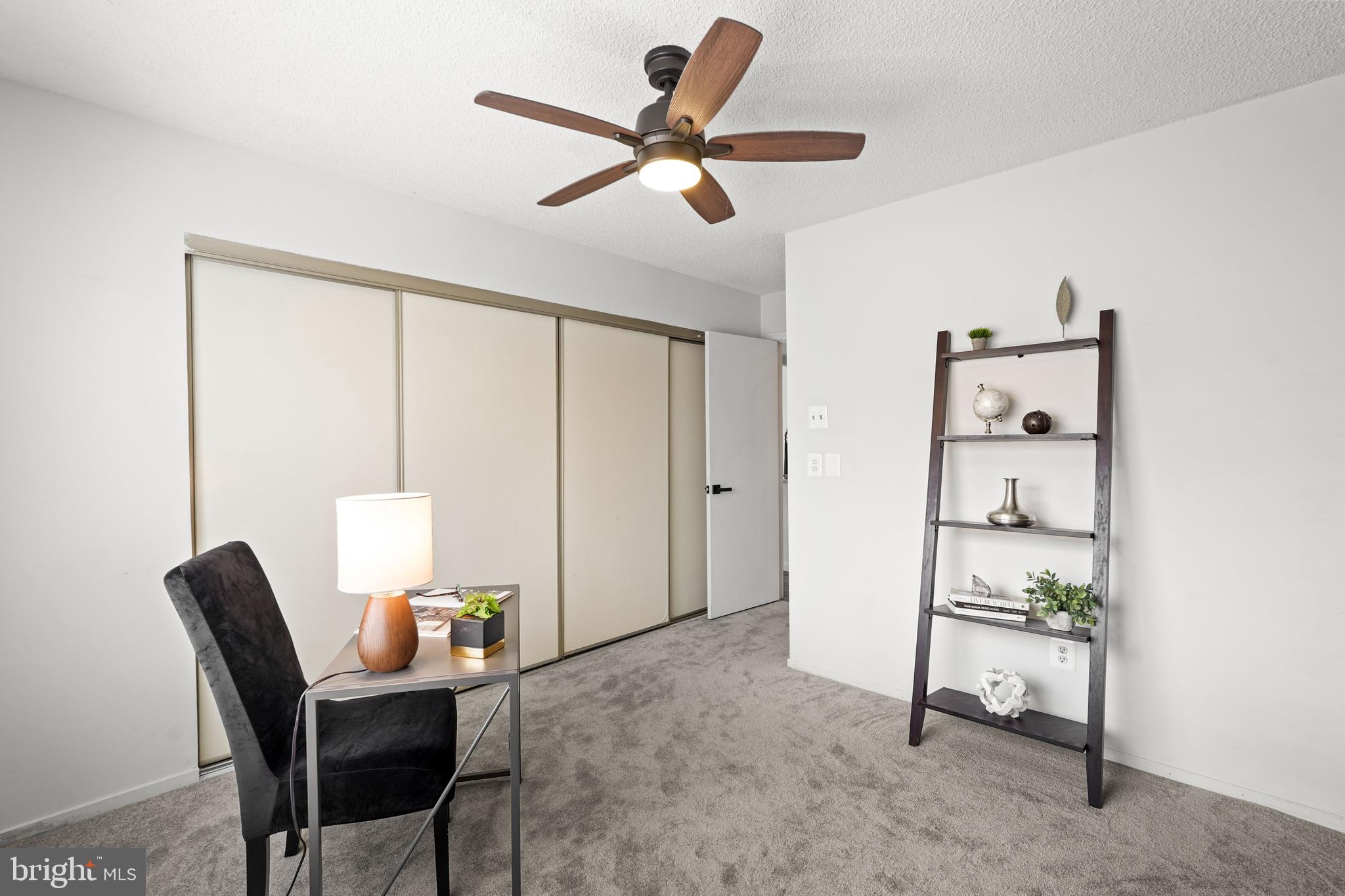 11731 Summerchase Circle, Unit 1731E Reston, VA 20194 - Photo 19 of 30 a workspace with furniture and a window