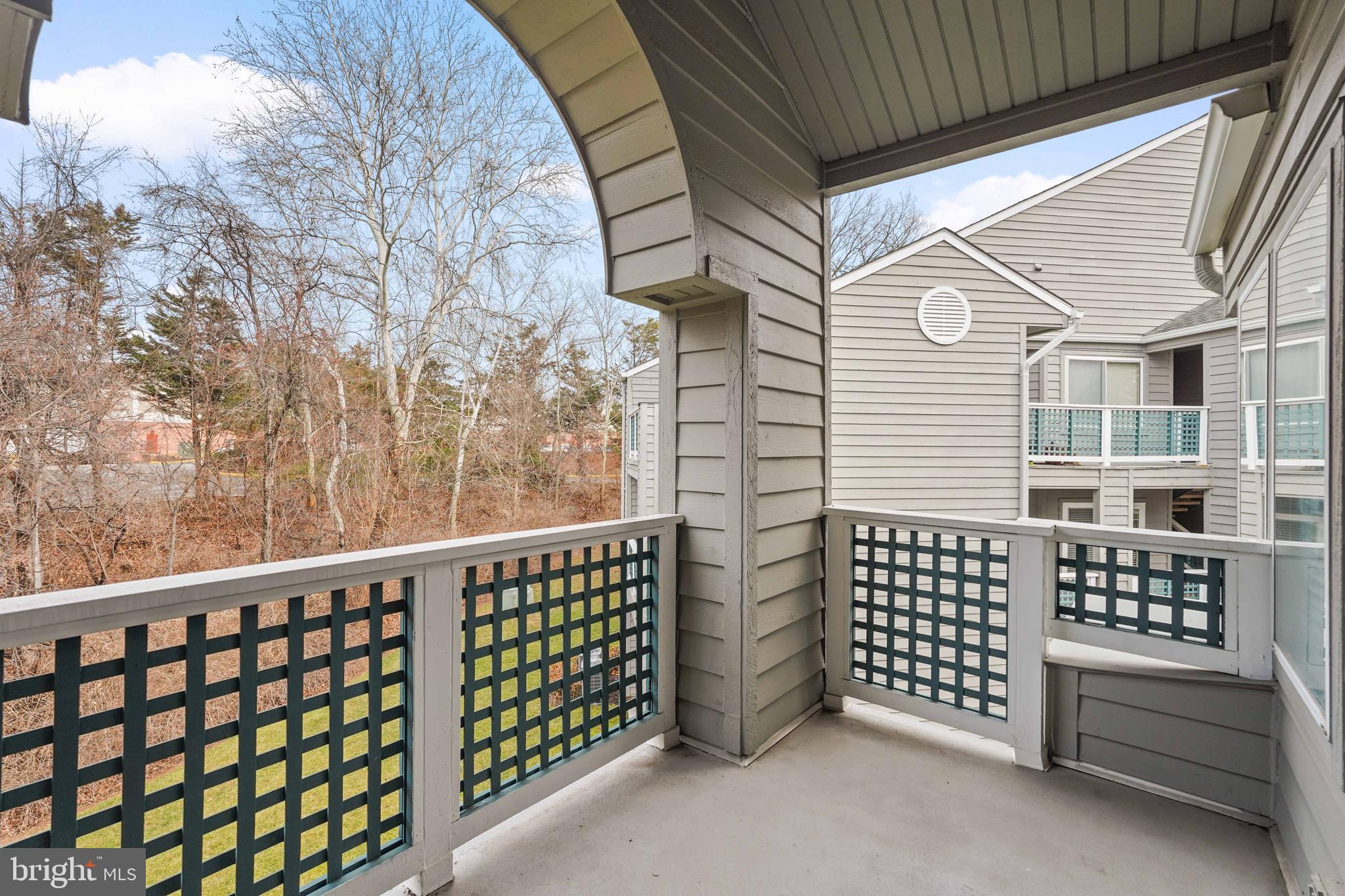11731 Summerchase Circle, Unit 1731E Reston, VA 20194 - Photo 22 of 30 a view of a porch with wooden fence