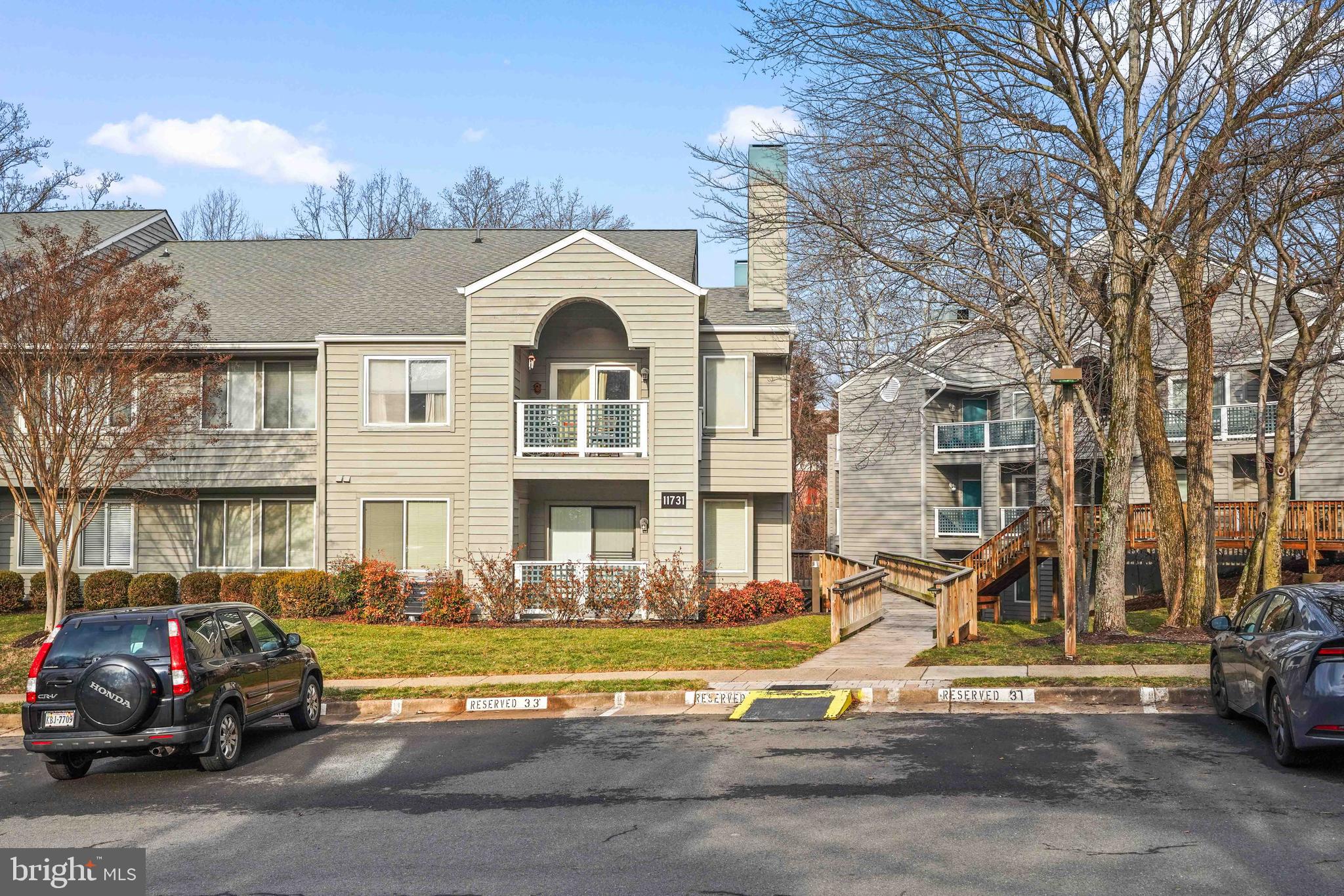 11731 Summerchase Circle, Unit 1731E Reston, VA 20194 - Photo 26 of 30 a view of a street that has couple of cars parked on the road