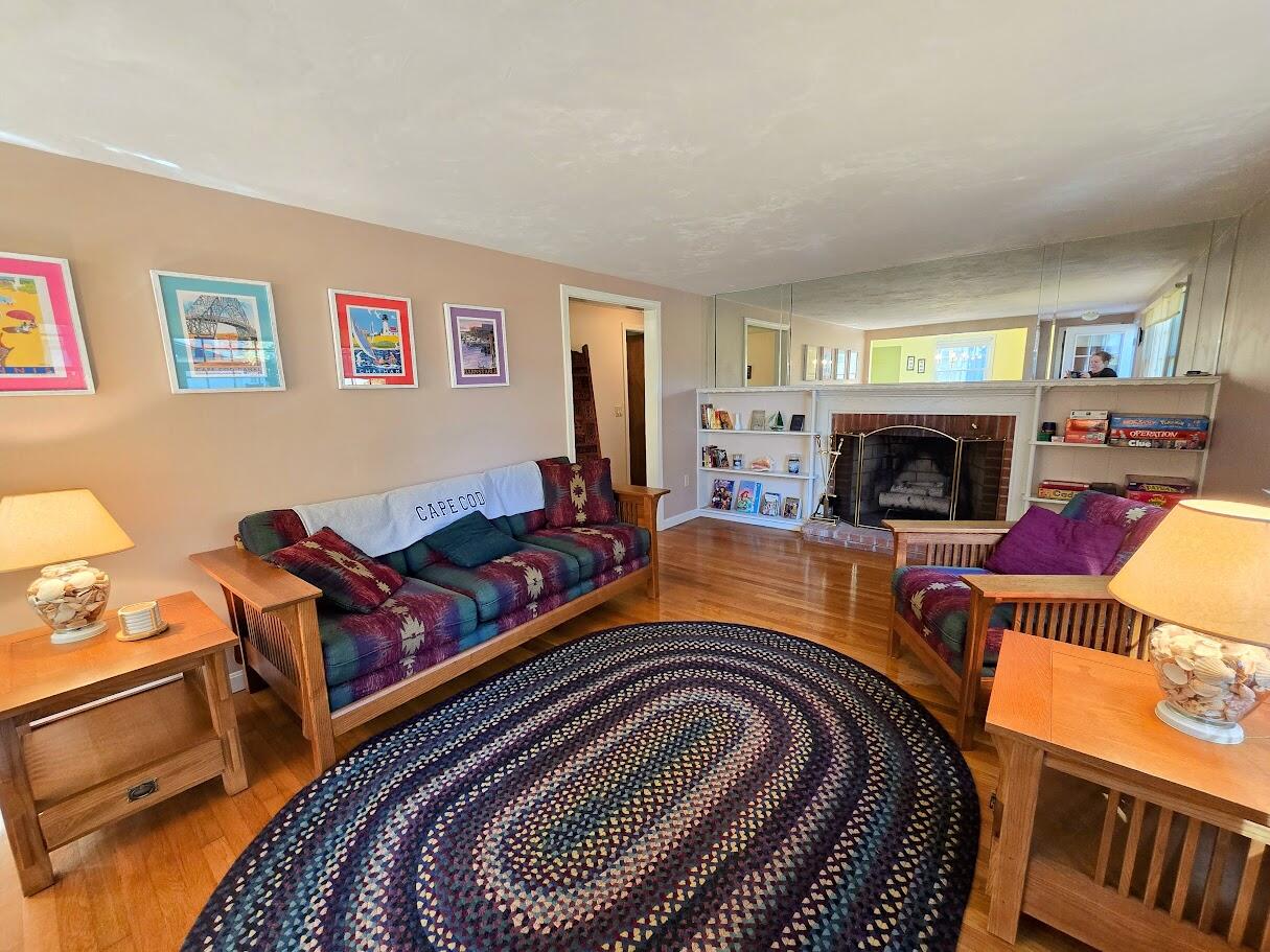 15 Woodside Park Road West Dennis, MA 02670 - Photo 14 of 35 a living room with furniture fireplace and flat screen tv