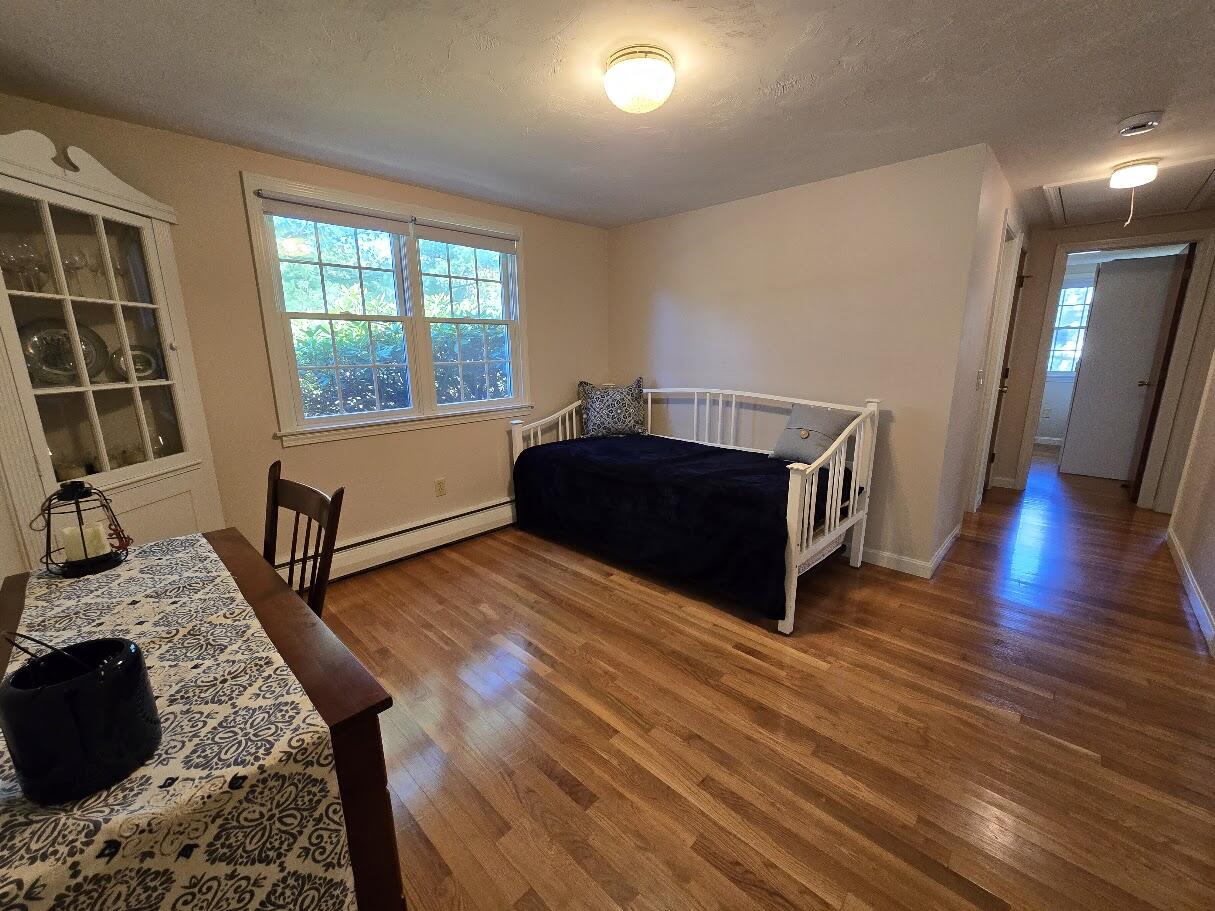 15 Woodside Park Road West Dennis, MA 02670 - Photo 16 of 35 a living room with furniture and a wooden floor