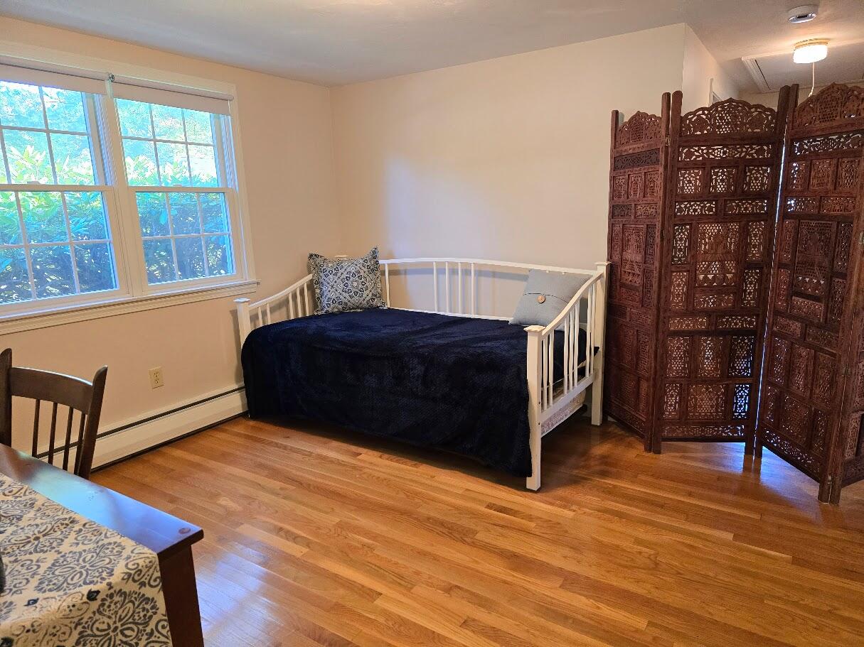 15 Woodside Park Road West Dennis, MA 02670 - Photo 17 of 35 a living room with a bed furniture and a window