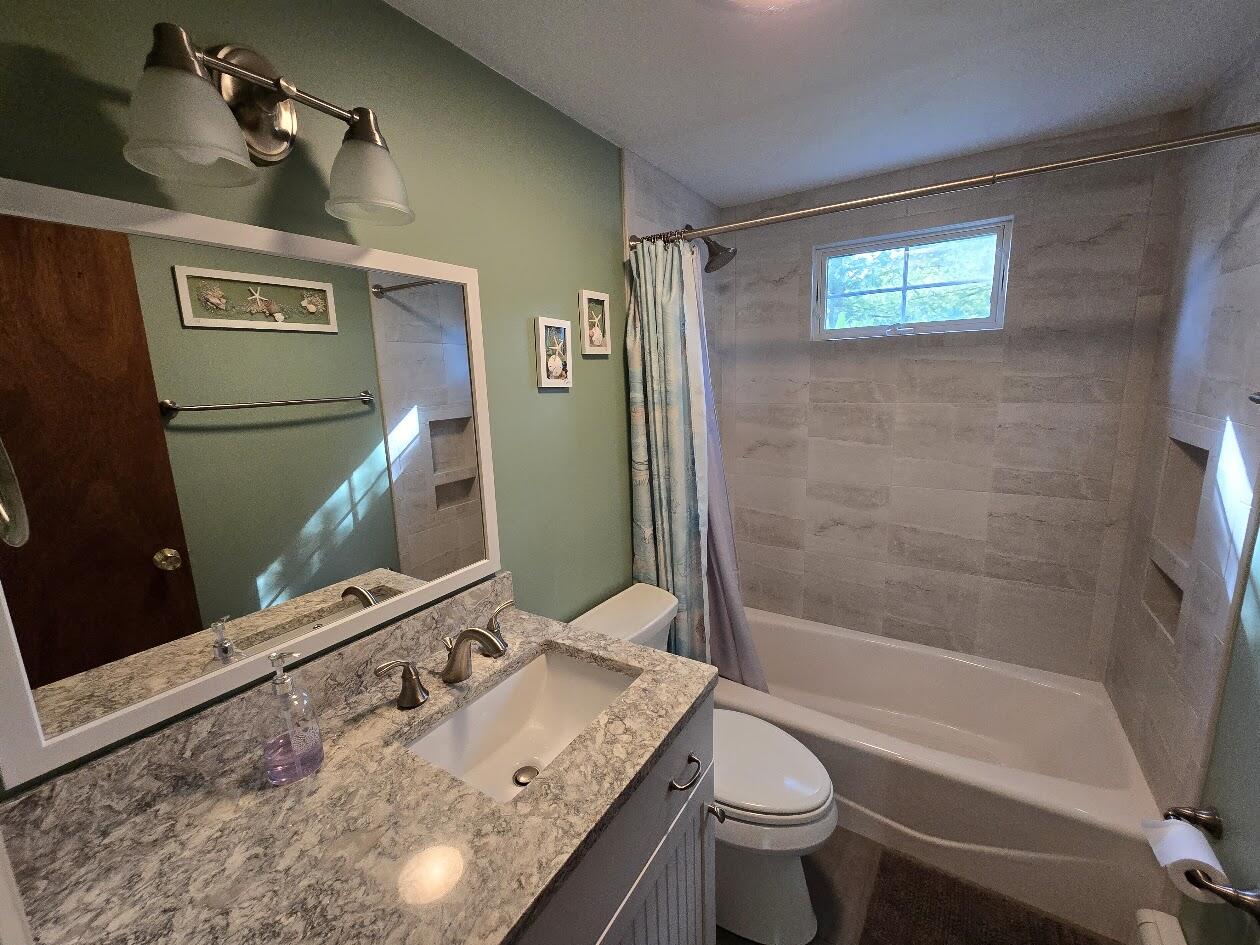 15 Woodside Park Road West Dennis, MA 02670 - Photo 24 of 35 a bathroom with a sink a toilet and shower