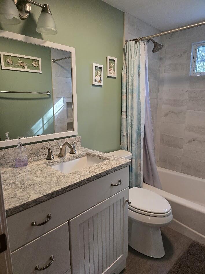 15 Woodside Park Road West Dennis, MA 02670 - Photo 25 of 35 a bathroom with a granite countertop sink toilet and shower