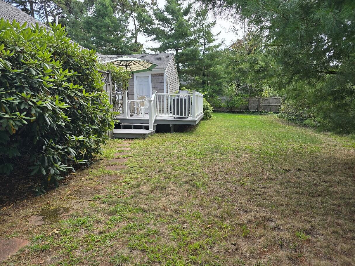 15 Woodside Park Road West Dennis, MA 02670 - Photo 30 of 35 a view of a house with backyard and garden