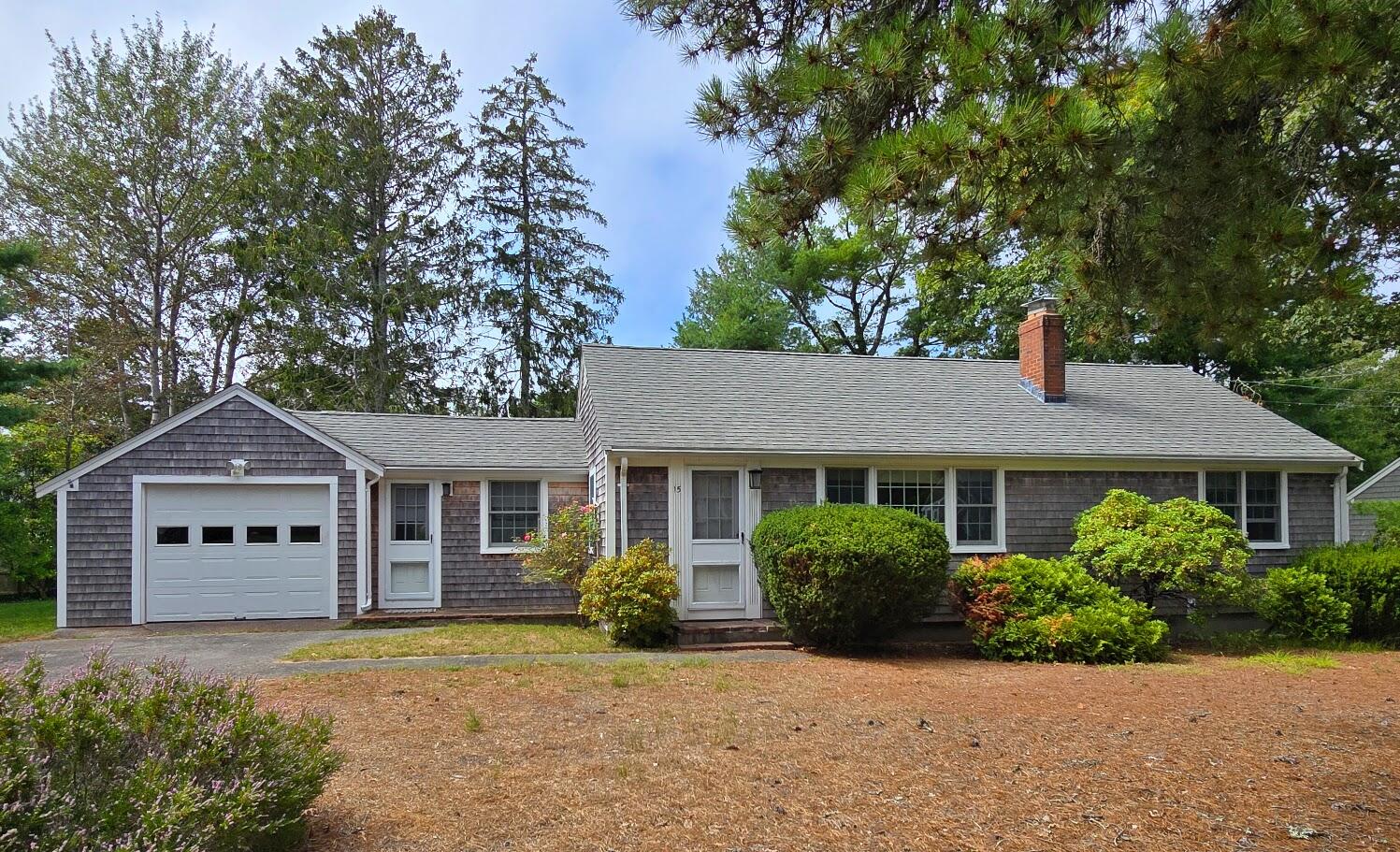 15 Woodside Park Road West Dennis, MA 02670 - Photo 33 of 35 a front view of a house with a garden