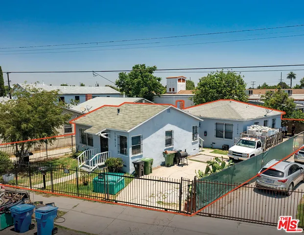 a view of multiple houses with a patio