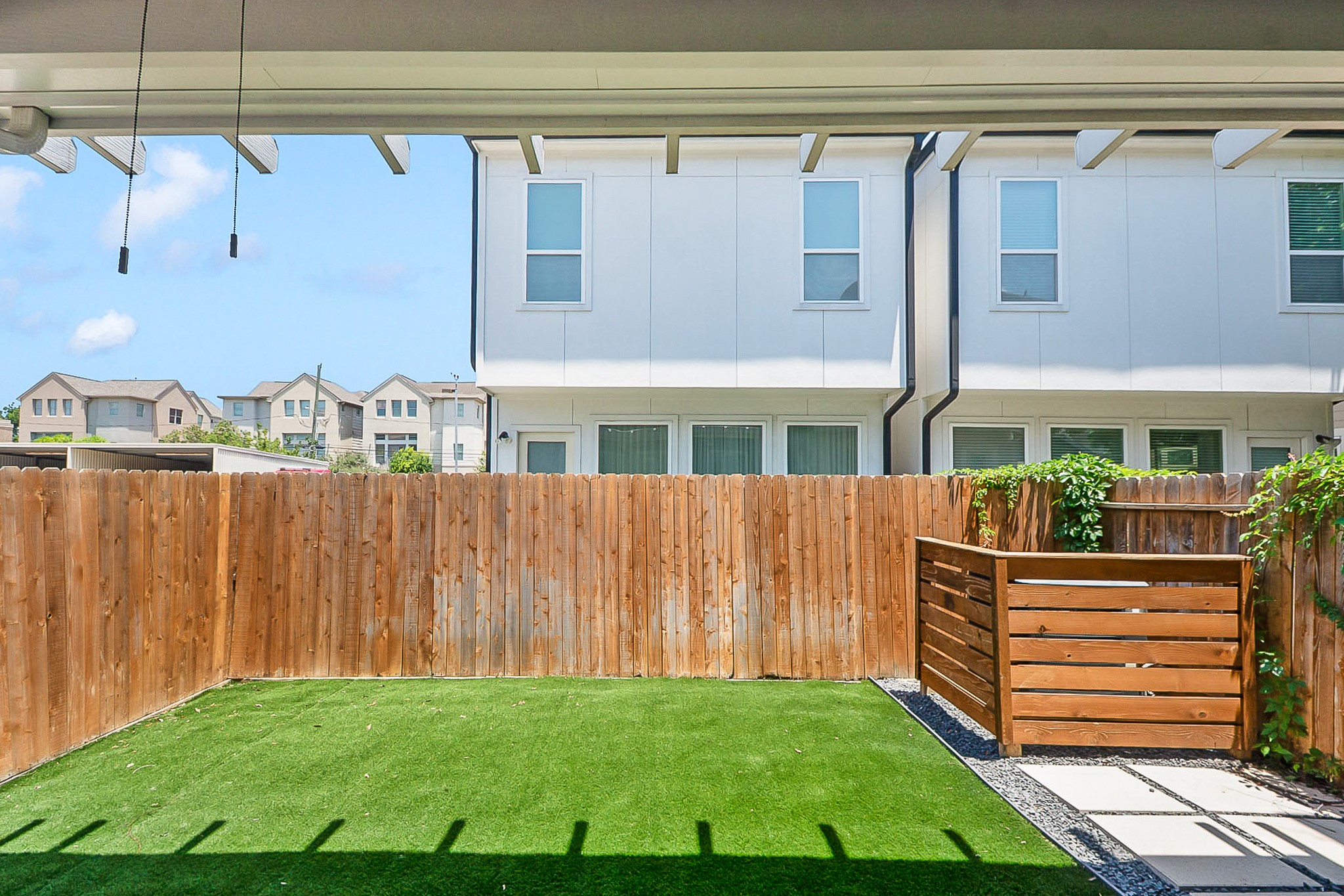 5328 Larkin Street Houston, TX 77007 - Photo 26 of 27 Backyard featuring low-maintenance turf, offering a clean, green outdoor space year-round.