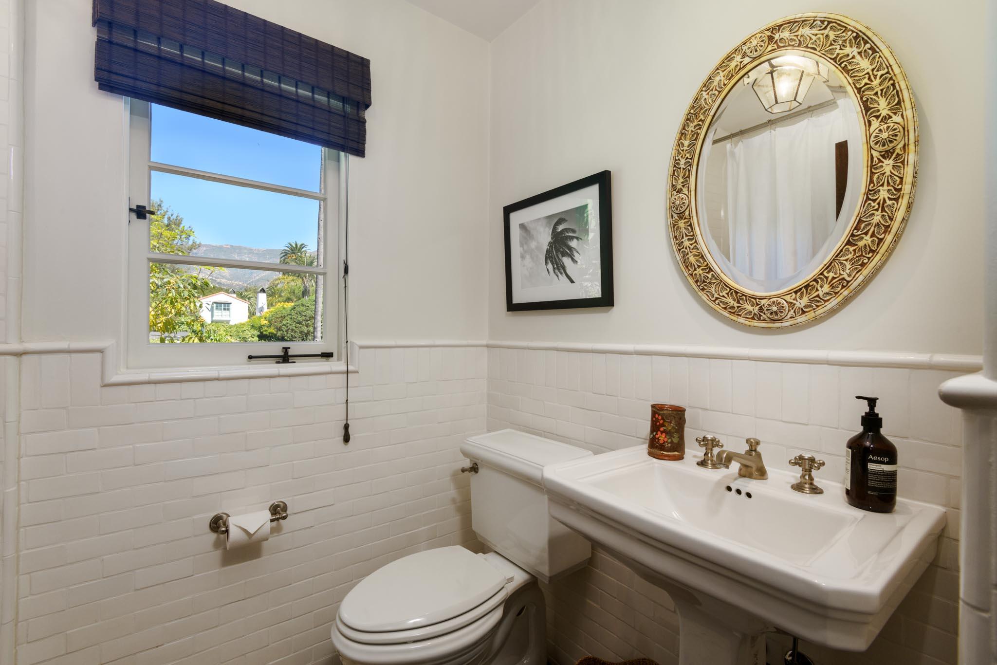 1530 Lingate Lane Montecito, CA 93108 - Photo 15 of 23 a bathroom with a toilet a sink and a mirror