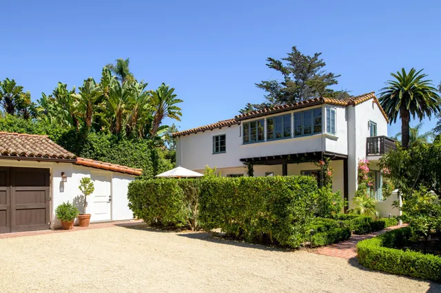front view of a house with a garden