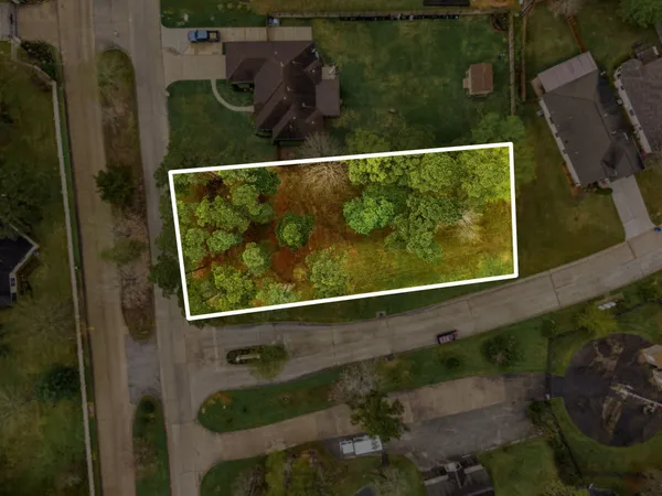 an aerial view of residential building with parking space