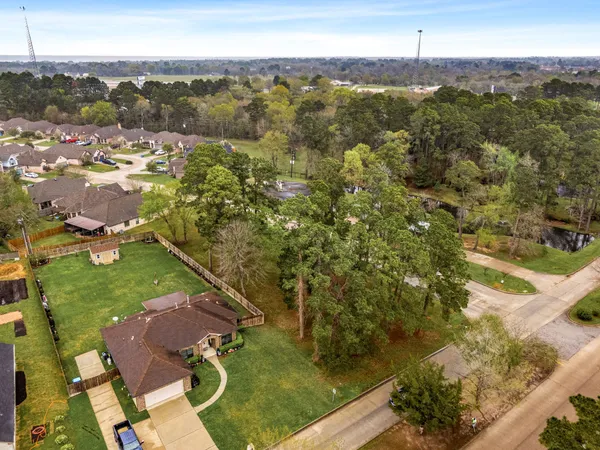 an aerial view of residential houses with outdoor space
