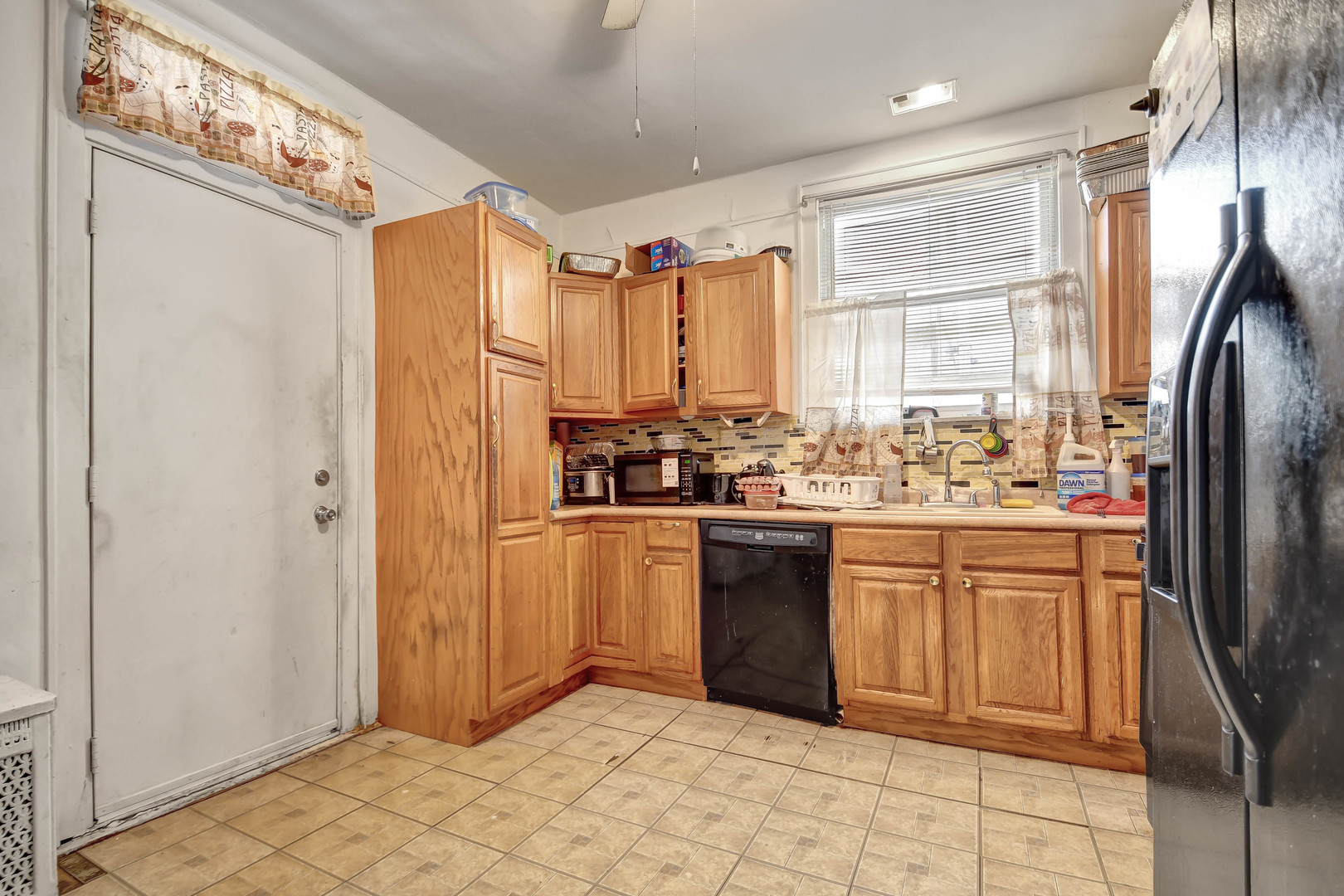 8212 South Bishop Street Chicago, IL 60620 - Photo 7 of 23 a kitchen with stainless steel appliances granite countertop a refrigerator and a sink