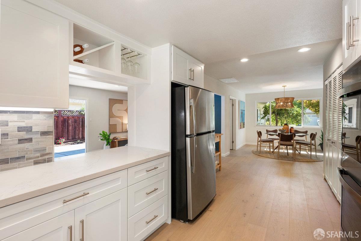 714 Wimbledon Road Walnut Creek, CA 94598 - Photo 20 of 58 a kitchen with refrigerator and cabinets