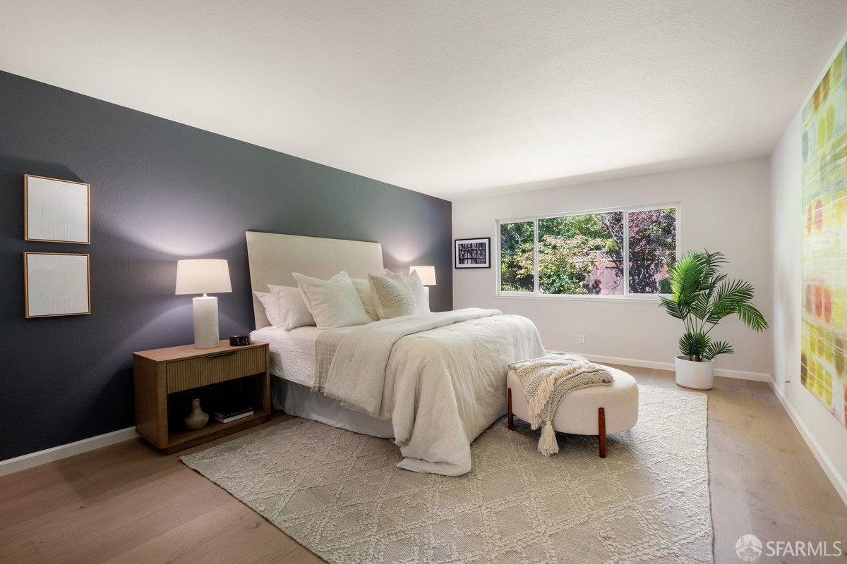 714 Wimbledon Road Walnut Creek, CA 94598 - Photo 22 of 58 a spacious bedroom with a bed and a couch