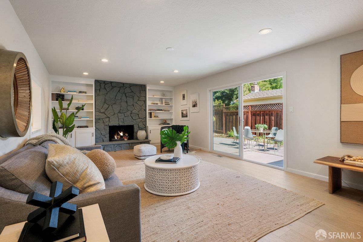714 Wimbledon Road Walnut Creek, CA 94598 - Photo 36 of 58 a living room with furniture a fireplace and a table