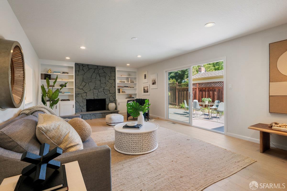 714 Wimbledon Road Walnut Creek, CA 94598 - Photo 37 of 58 a living room with furniture a fireplace and a table