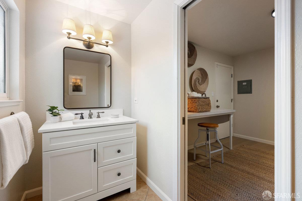 714 Wimbledon Road Walnut Creek, CA 94598 - Photo 46 of 58 a bathroom with a toilet sink and mirror