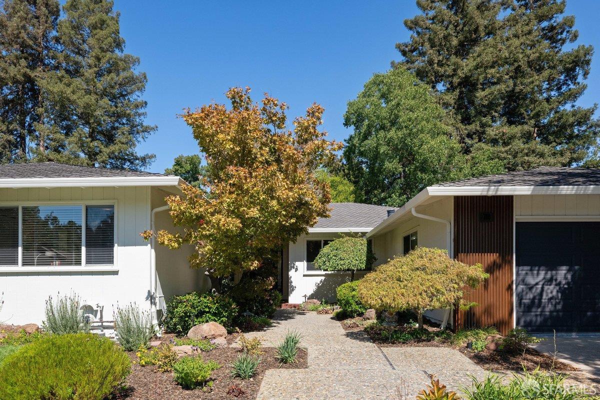 714 Wimbledon Road Walnut Creek, CA 94598 - Photo 5 of 58 a front view of a house with a garden