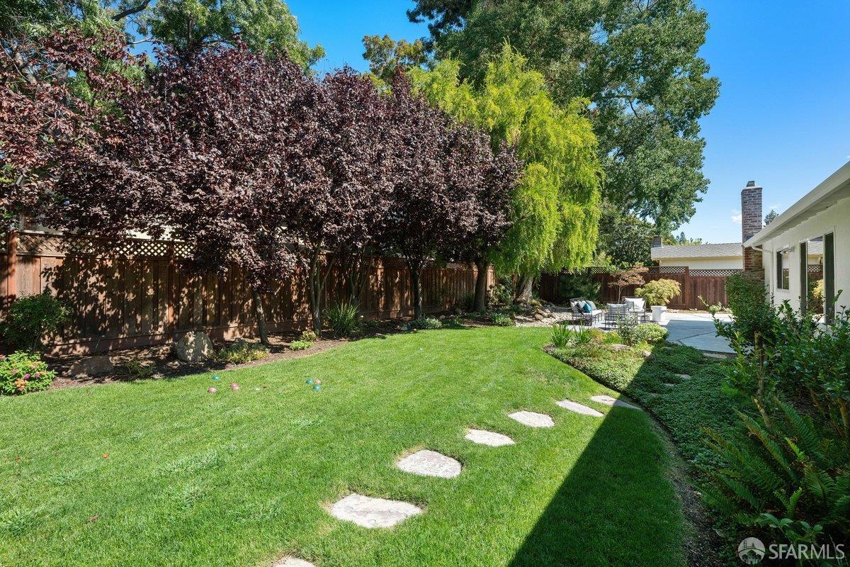 714 Wimbledon Road Walnut Creek, CA 94598 - Photo 52 of 58 a view of a backyard with a garden