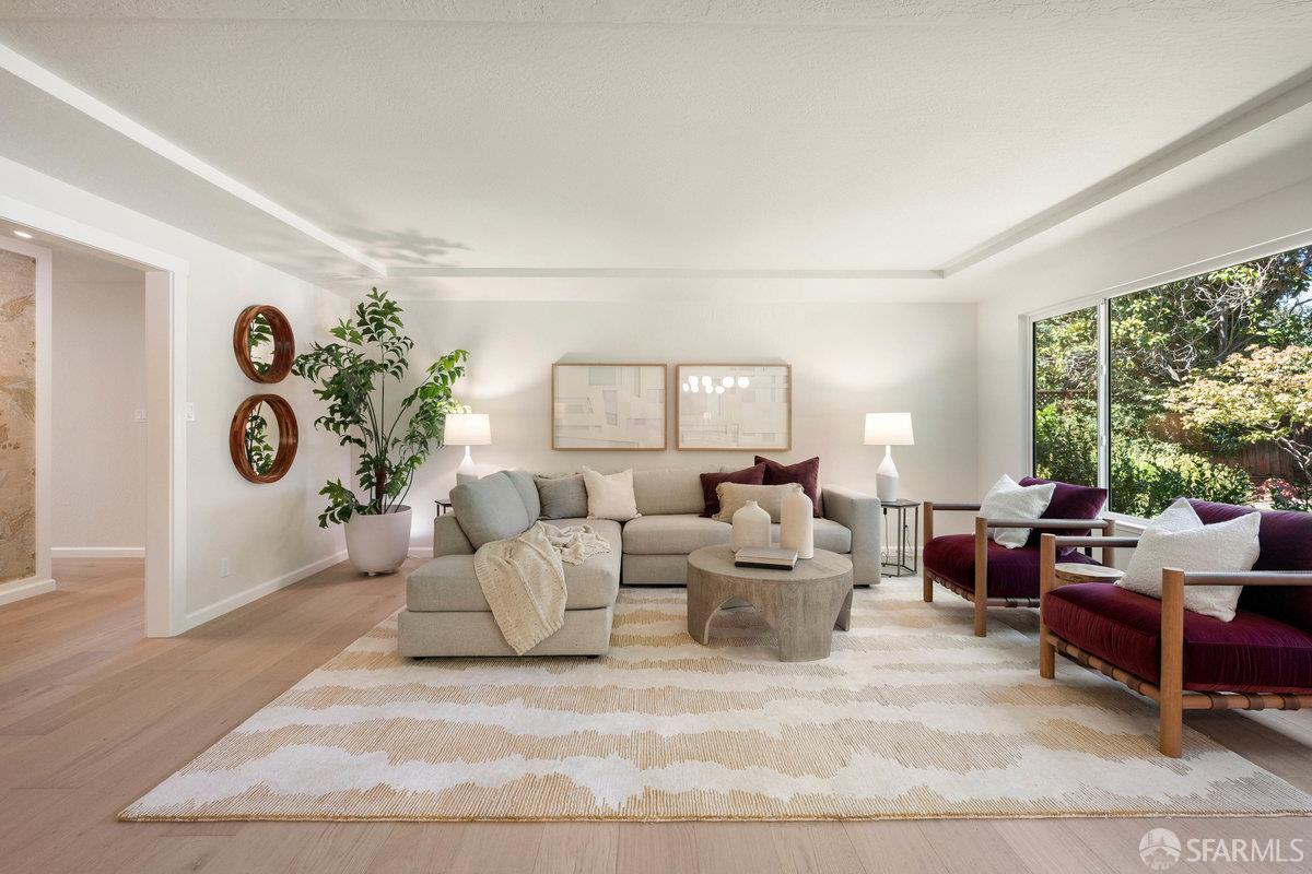 714 Wimbledon Road Walnut Creek, CA 94598 - Photo 7 of 58 a living room with patio furniture and a large window