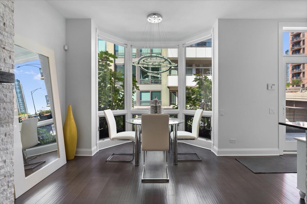 641 West Wayman Street, Unit B Chicago, IL 60661 - Photo 4 of 25 a dining room with furniture window and wooden floor