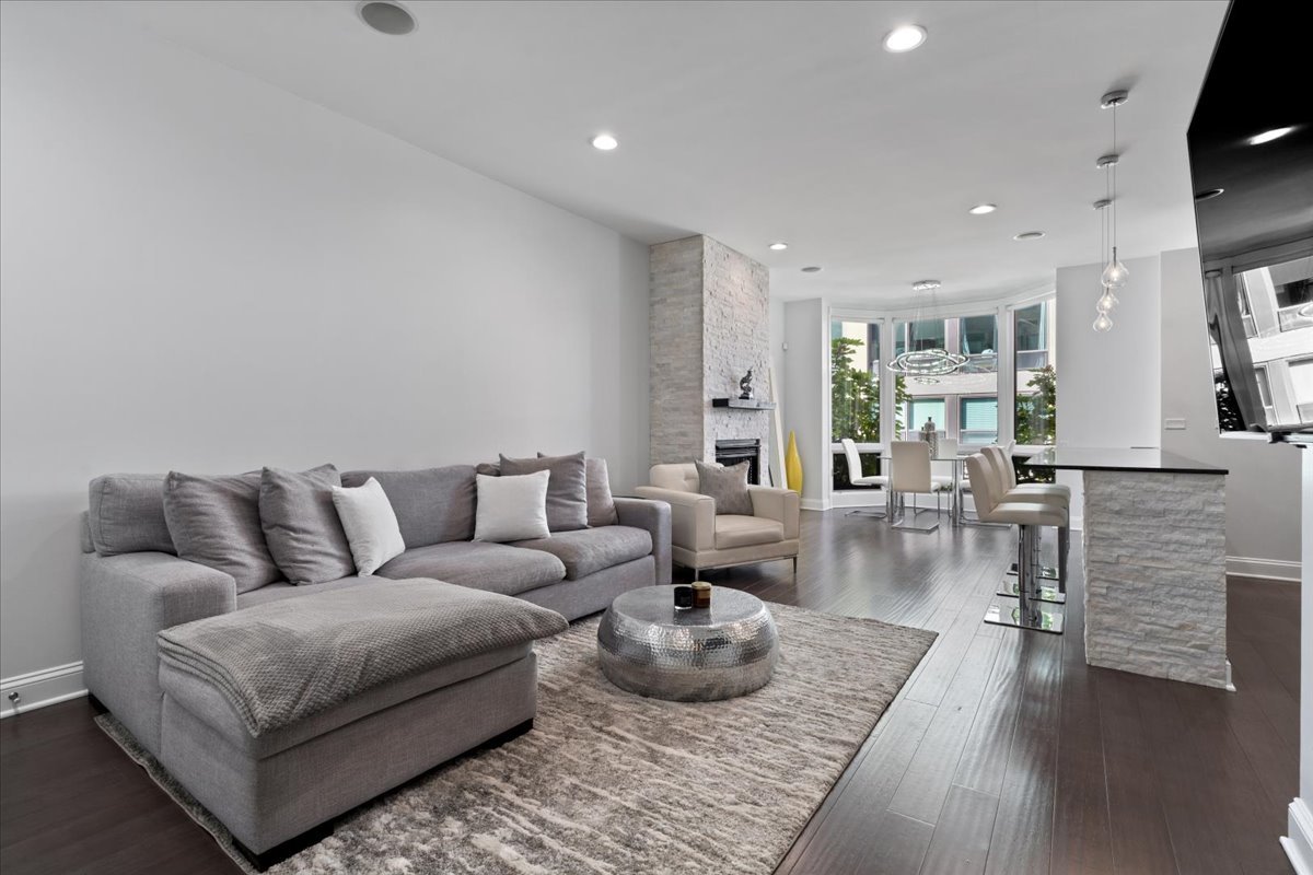 641 West Wayman Street, Unit B Chicago, IL 60661 - Photo 7 of 25 a living room with furniture and wooden floor