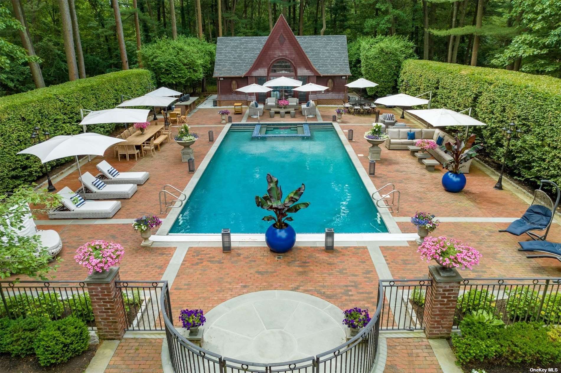 a view of a swimming pool and lounge chairs
