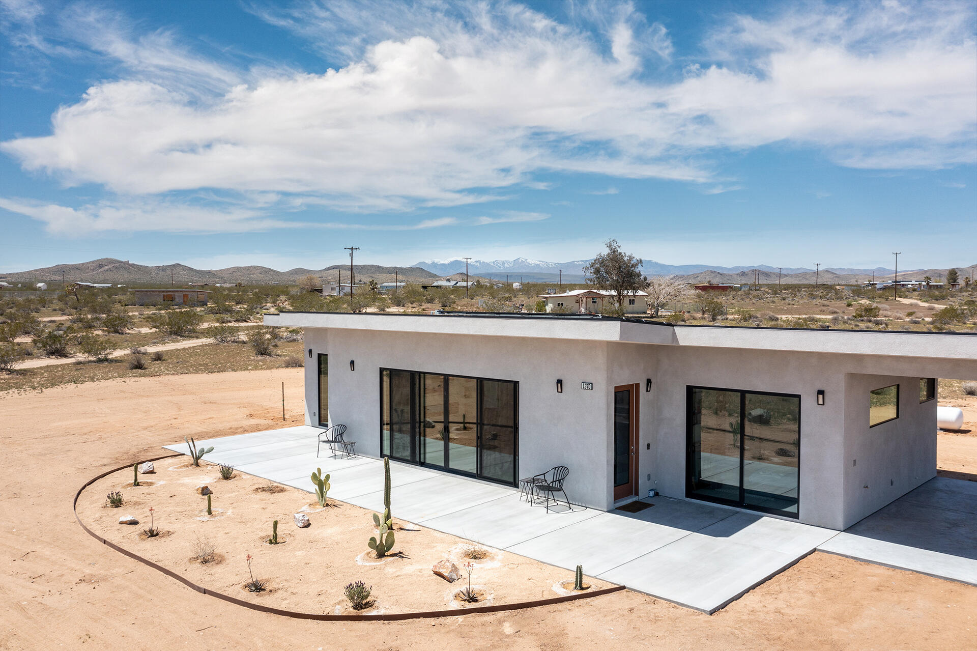 1370 Mc Garry Road Joshua Tree, CA 92252 - Photo 28 of 32 a view of a swimming pool with a terrace