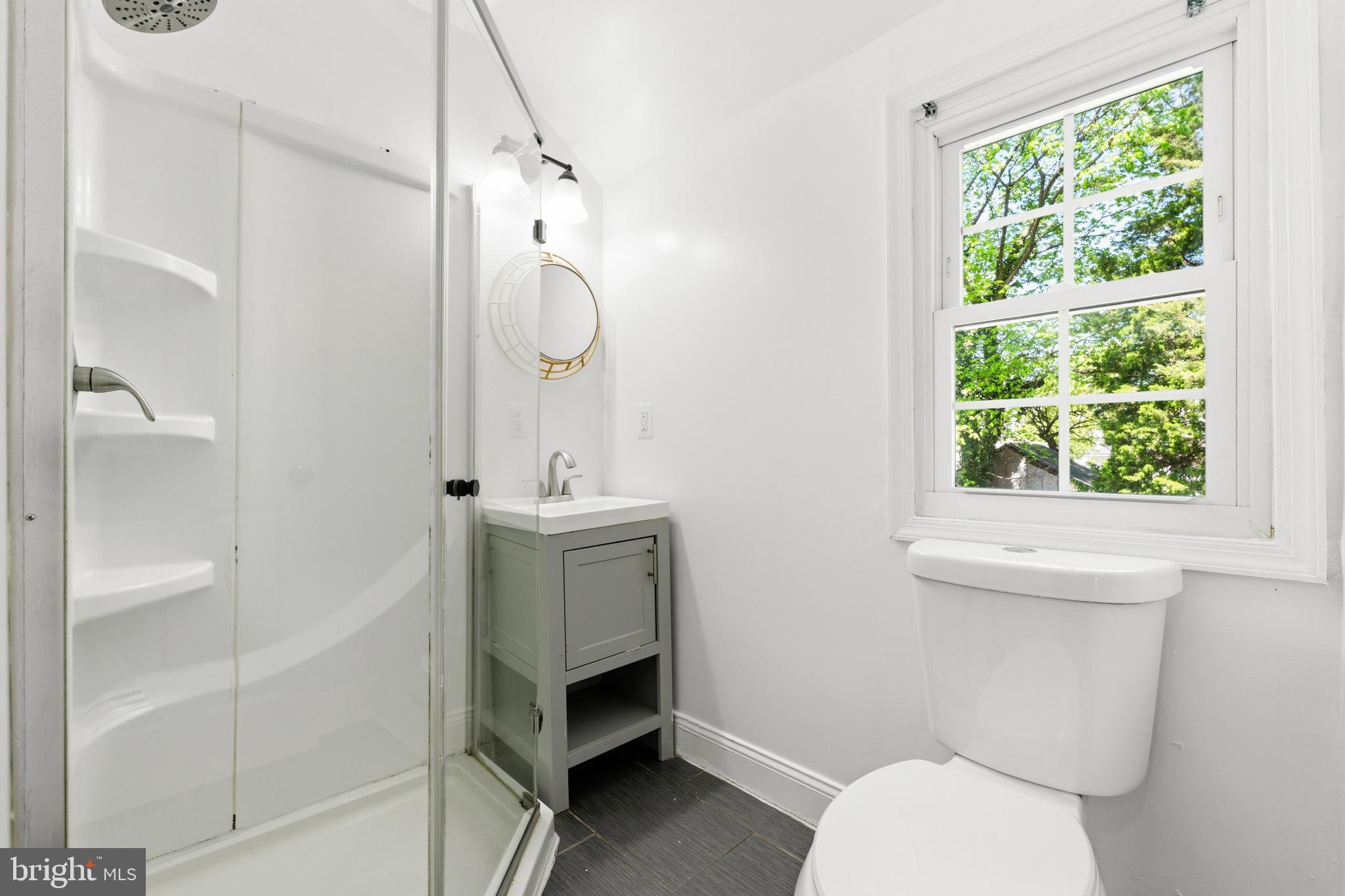 7204 East Inwood Street Landover, MD 20785 - Photo 19 of 24 a bathroom with a toilet sink and shower