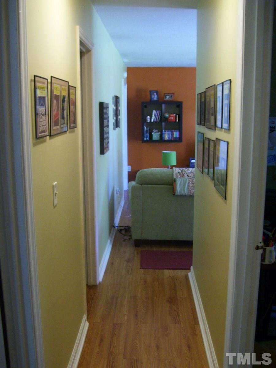 2153 Winkler Road Durham, NC 27712 - Photo 11 of 21 a living room with furniture and a wooden floor
