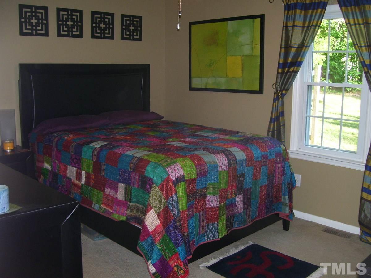 2153 Winkler Road Durham, NC 27712 - Photo 12 of 21 a bedroom with a bed and a window