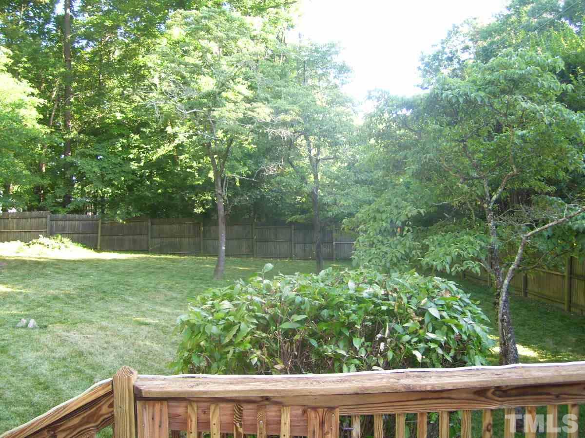 2153 Winkler Road Durham, NC 27712 - Photo 18 of 21 a view of a wooden fence and trees in the background