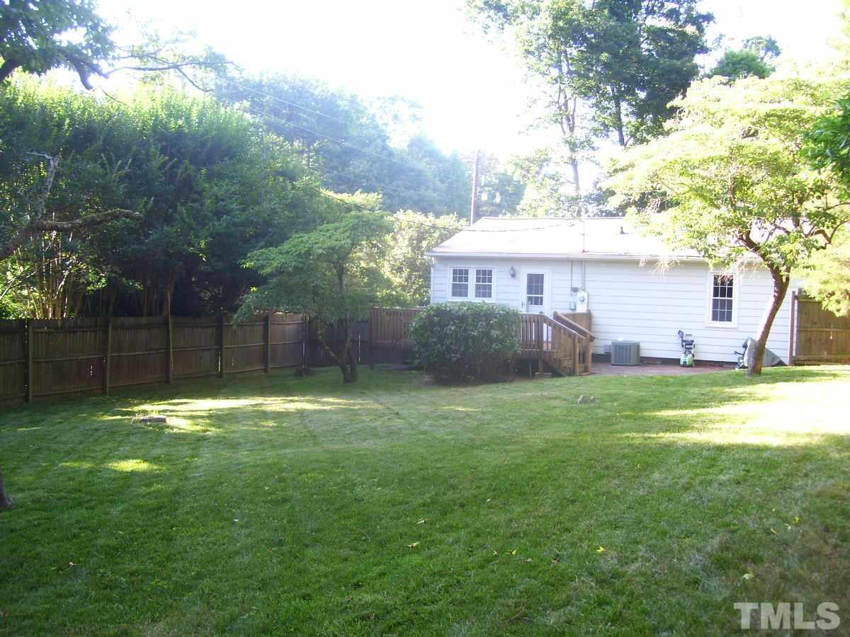 2153 Winkler Road Durham, NC 27712 - Photo 20 of 21 a backyard of a house with table and chairs