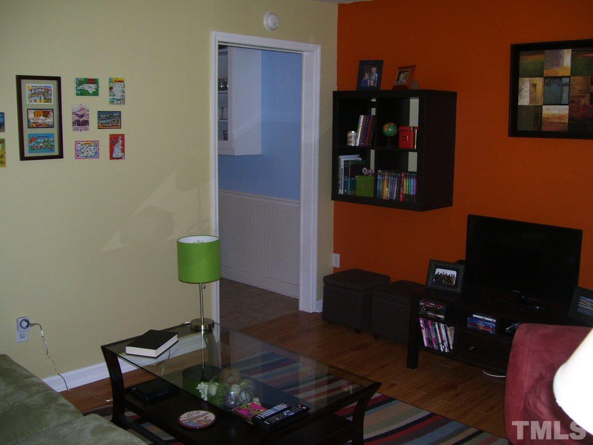 2153 Winkler Road Durham, NC 27712 - Photo 9 of 21 a living room with furniture and wooden floor