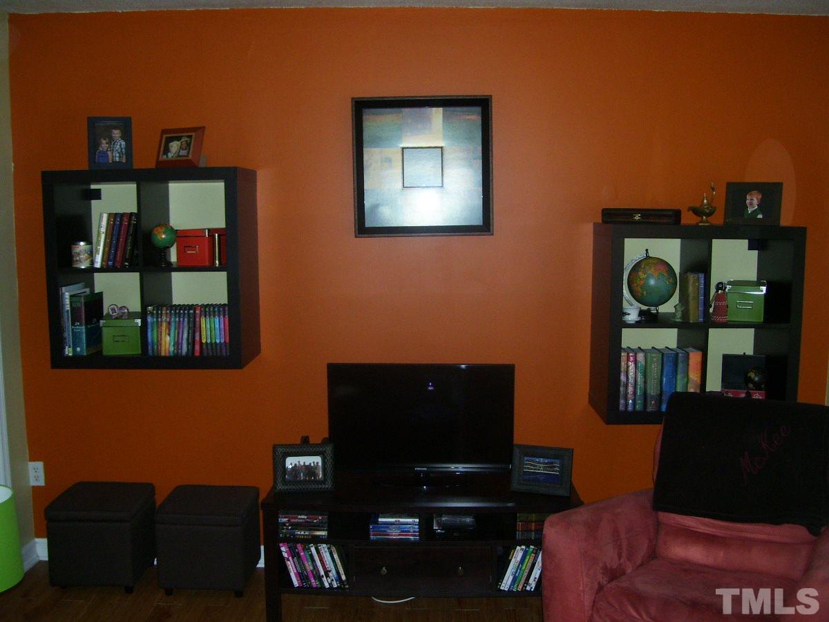 2153 Winkler Road Durham, NC 27712 - Photo 10 of 21 a living room with furniture and a lamp