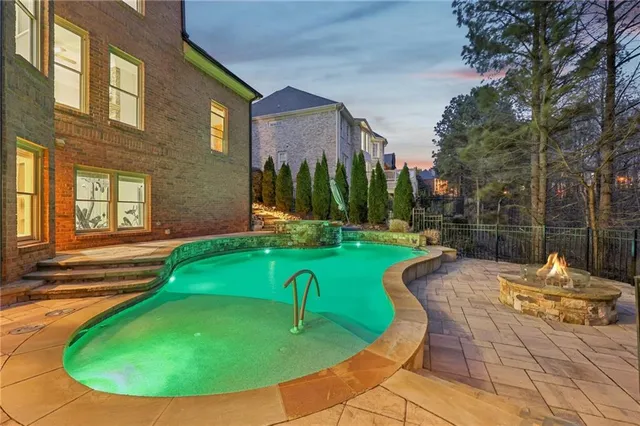 a view of a house with a backyard porch and sitting area