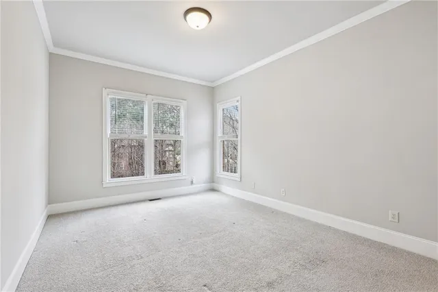 an empty room with closet area