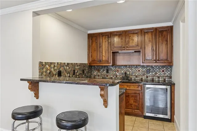a view of an empty room with a window and a ceiling fan