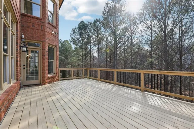 a front view of a house with garden and porch