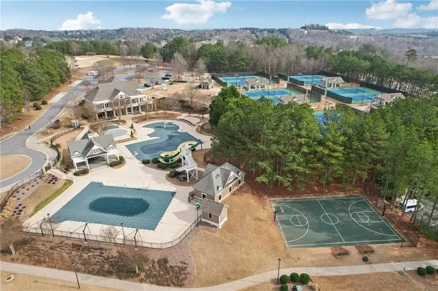 a view of a swimming pool with a yard