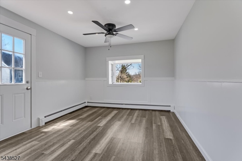 83 Highway 15 Lafayette, NJ 07848 - Photo 19 of 20 a view of empty room with wooden floor and fan
