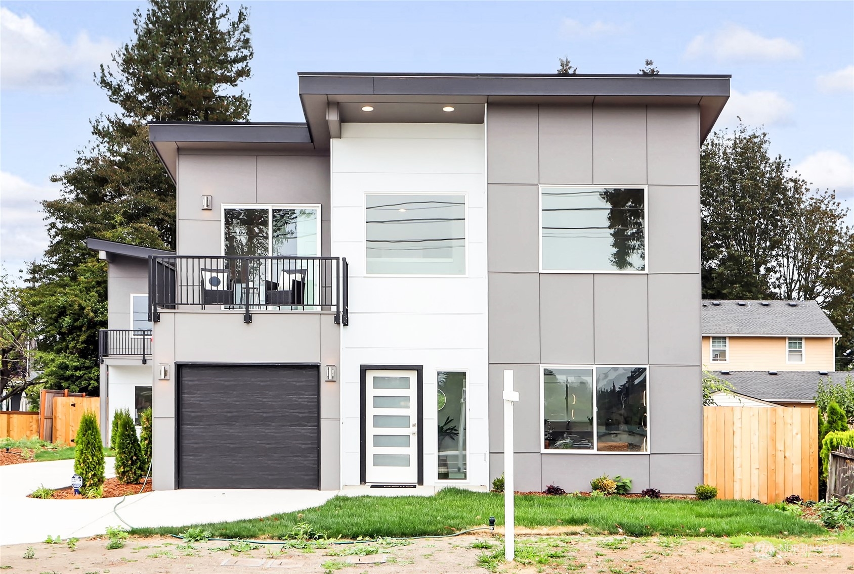 846 Southwest 136th Street, Unit 1 Burien, WA 98166 - Photo 1 of 18 a front view of a house with a yard
