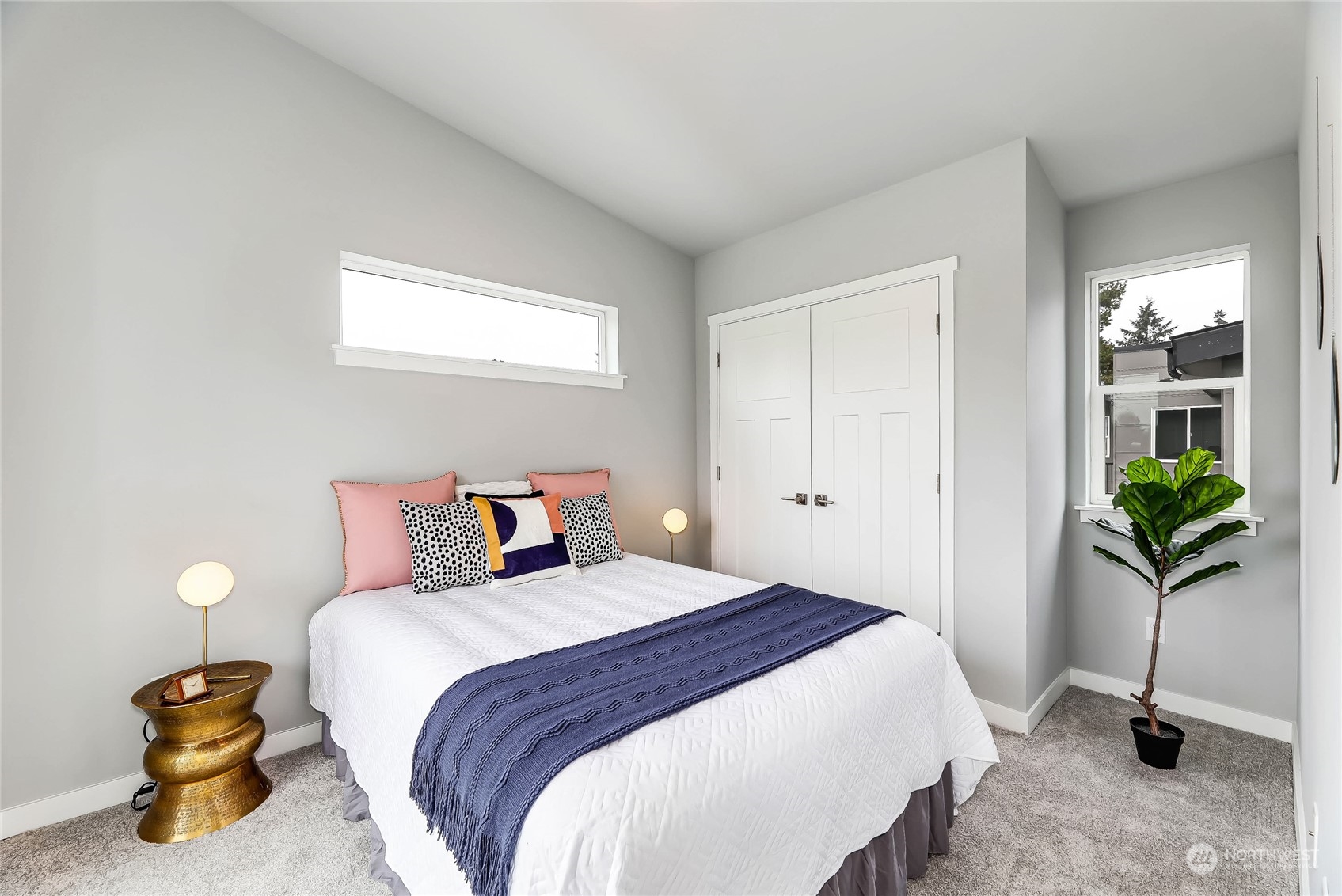 846 Southwest 136th Street, Unit 1 Burien, WA 98166 - Photo 11 of 18 a bedroom with a bed and potted plant