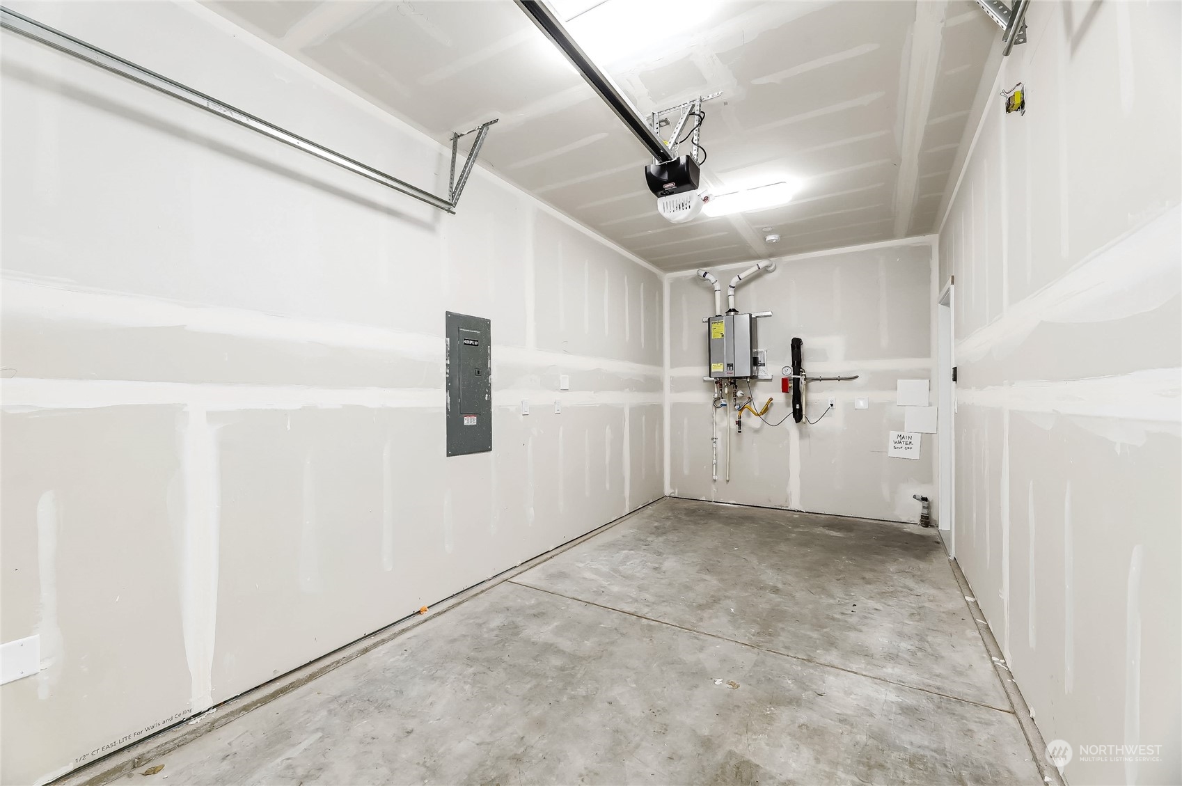 846 Southwest 136th Street, Unit 1 Burien, WA 98166 - Photo 15 of 18 a view of a refrigerator in kitchen and white walls